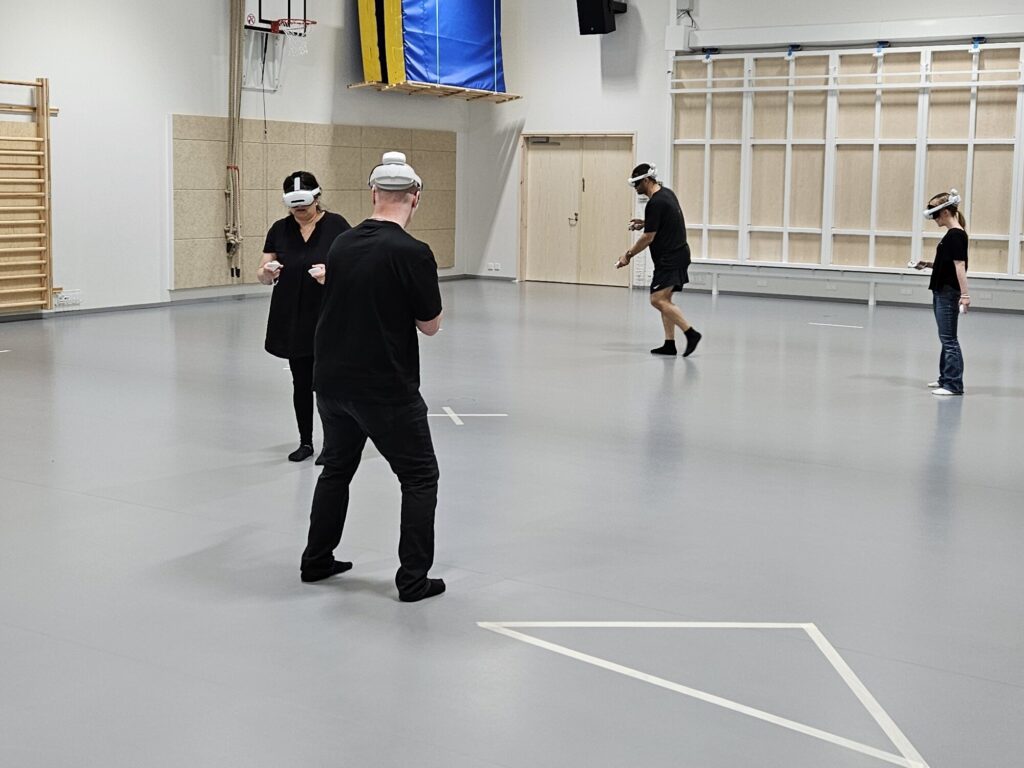 Four players playing virtual reality games